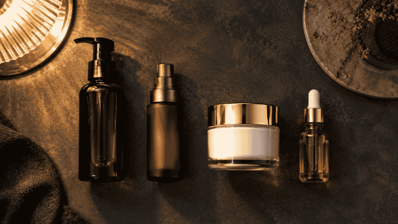 Complete evening skincare layering sequence — cleanser, retinol serum, ceramide moisturiser and face oil for mature anti-aging routine