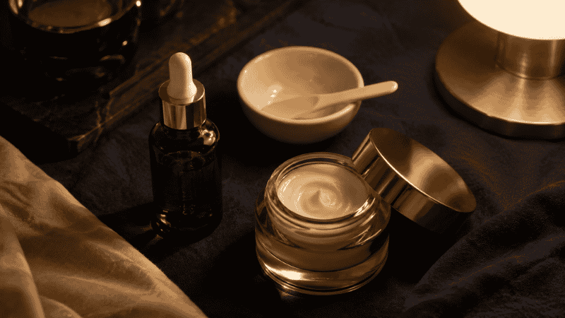 Evening luxury skincare routine with retinol serum and barrier repair cream for mature skin