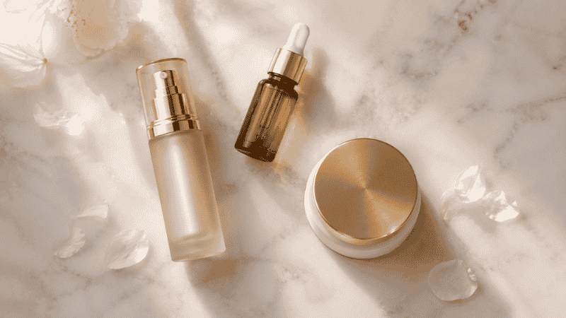 Luxury peptide serum, vial and moisturiser on marble — what do peptides do for skin