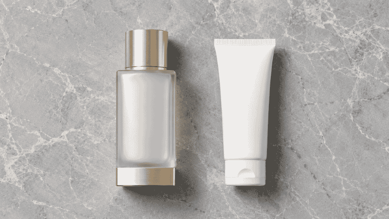 Luxury mineral sunscreen in glass packaging beside standard formula — is luxury mineral sunscreen worth the premium for anti-aging