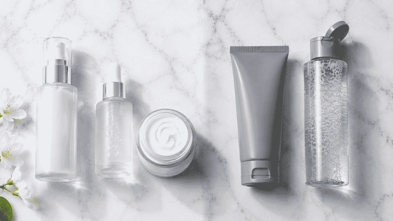 Gentle barrier-friendly skincare beside harsh acne products — menopausal skin care guide showing what to use and what to stop using for perimenopause acne