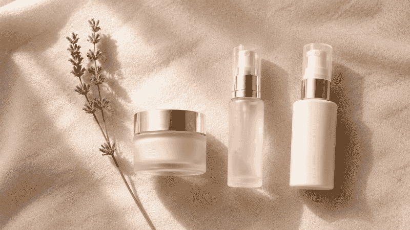 Ceramide moisturiser, bakuchiol serum and niacinamide on warm linen with dried botanicals — skincare for perimenopausal skin addressing hormonal shift with barrier support