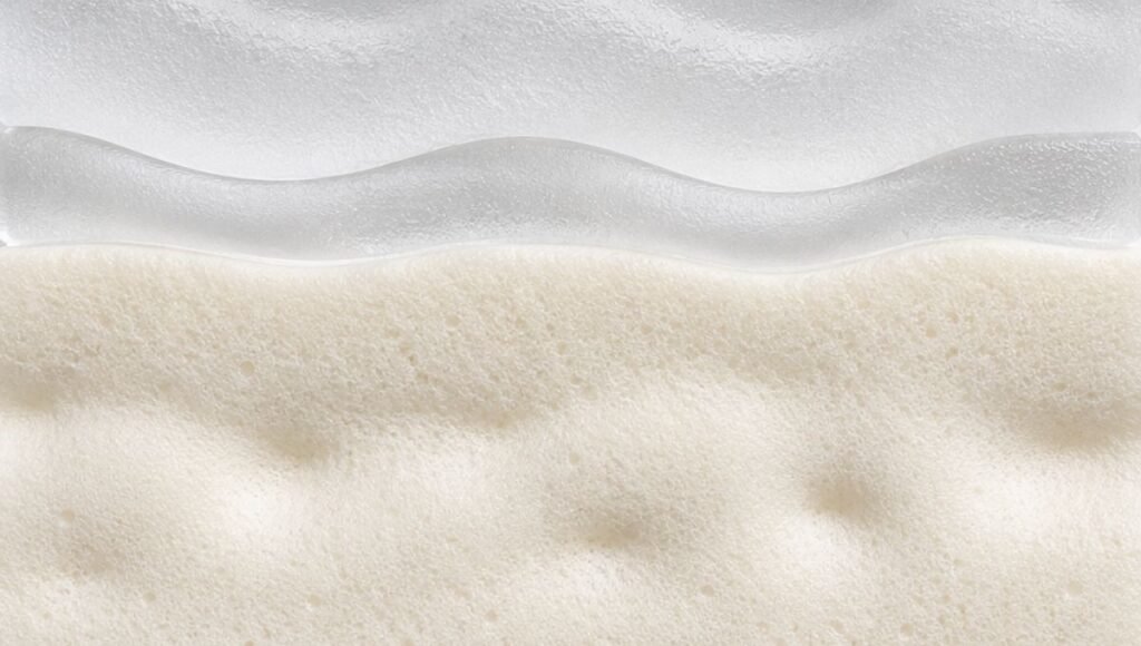 Four horizontal layers from ceramic to stone representing skin collagen fat pad and bone structure — why skin loses firmness after 40 including collagen elastin fat pad descent and bone resorption